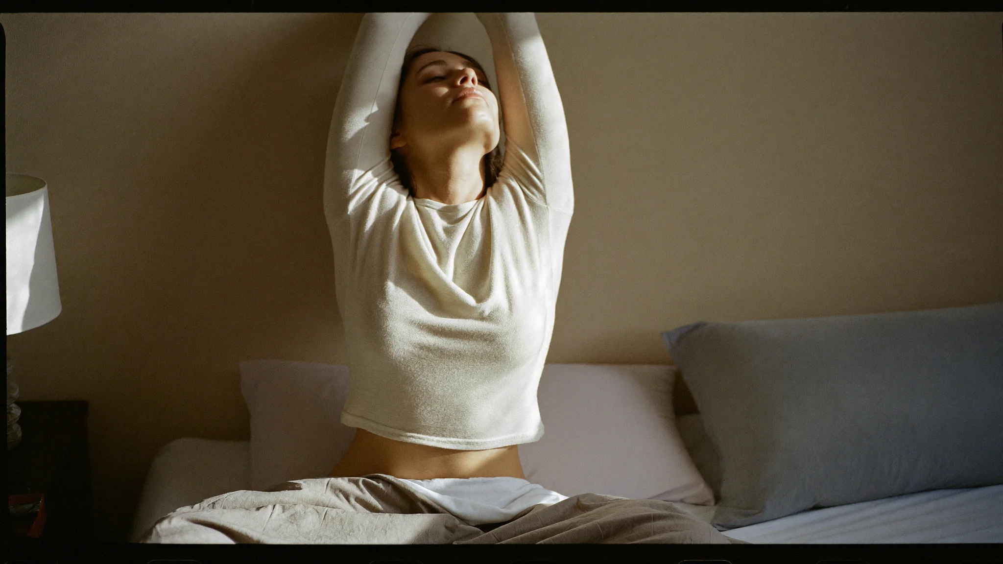 Woman resting peacefully after restoring healthy cortisol rhythm and sleep architecture